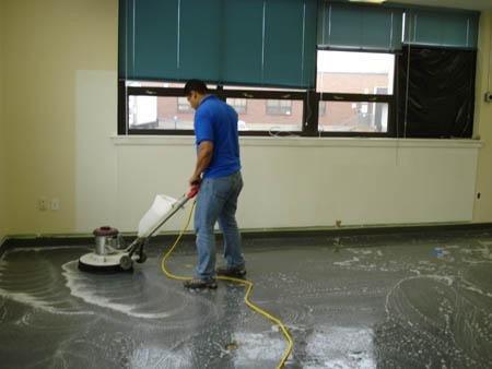 A Man cleaning a floor